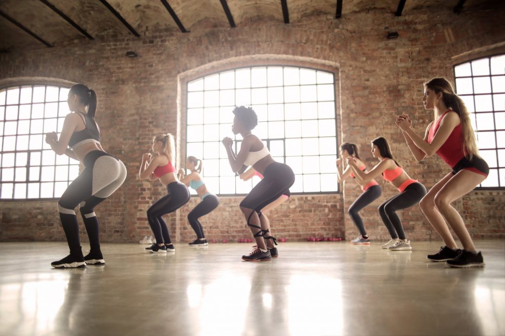 group of girls doing squat