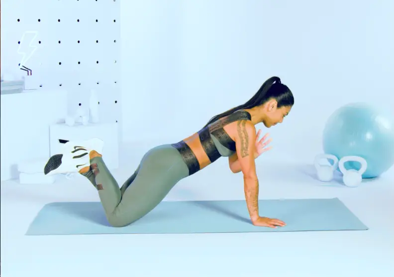 Woman Doing Plank Tap Bodyweight exercises for arms